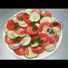 A picture of Tomato & cucumber salad.
