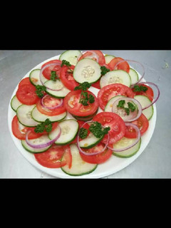 A picture of Tomato & cucumber salad.
