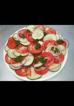 A picture of Tomato & cucumber salad.