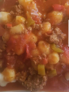Una foto de Ñoquis caseros con salsa