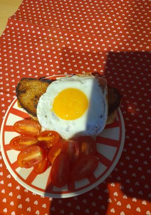 A picture of Croque Madam or cheese and ham toast with egg.