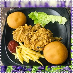 A picture of Kfc style chicken with French fries.