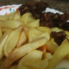 A picture of Fry chips and fry meat.