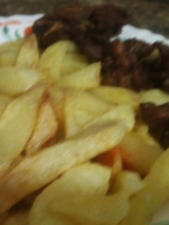 A picture of Fry chips and fry meat.