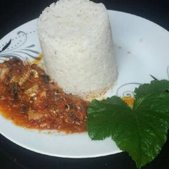 A picture of Fish stew with rice.