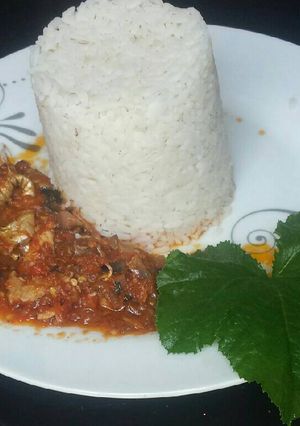 A picture of Fish stew with rice.
