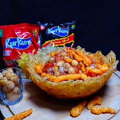 Kurkure Tezdhaar Chaat In Potato Nest A picture of Kurkure Tezdhaar Chaat In Potato Nest.