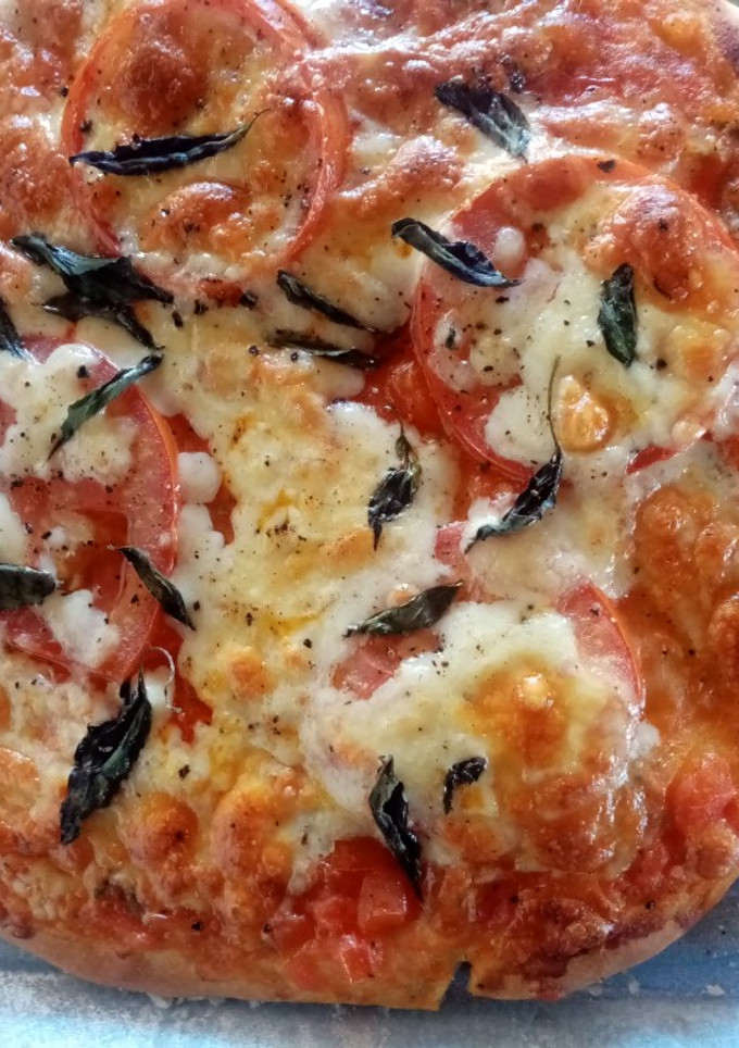 Una foto de Mini pizza Margarita 🧀🍅🍕