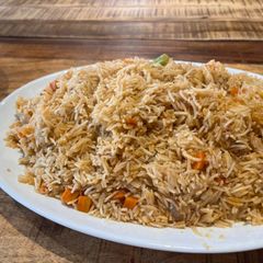 A picture of Basmati rice with lamb neck broth and fridge vegetables.