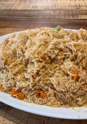 A picture of Basmati rice with lamb neck broth and fridge vegetables.