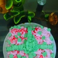 Azaadi roh afza cake with green ribbon and leave(I m not expert) A picture of Azaadi roh afza cake with green ribbon and leave(I m not expert).