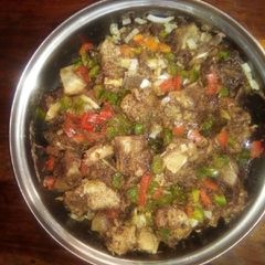 A picture of Beef stew with peppers.