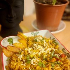 A picture of Veg Sizzling Sweet Corn Rice.