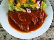 A picture of tomato pork chops