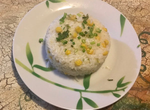 Una foto de Arroz con maíz tierno y aceite de coco