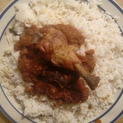 A picture of White rice and stew.