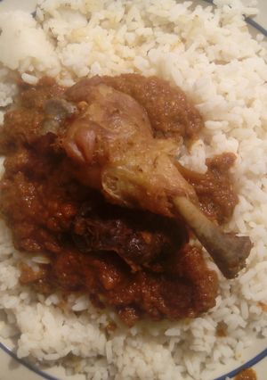 A picture of White rice and stew.