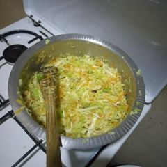A picture of Steamed cabbage and carrot.