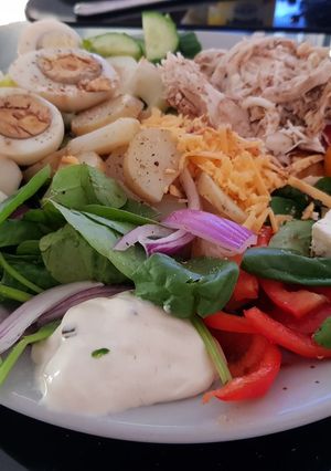 A picture of My Super Salad with tasty Chicken Eggs,2 cheese. With Sour cream.