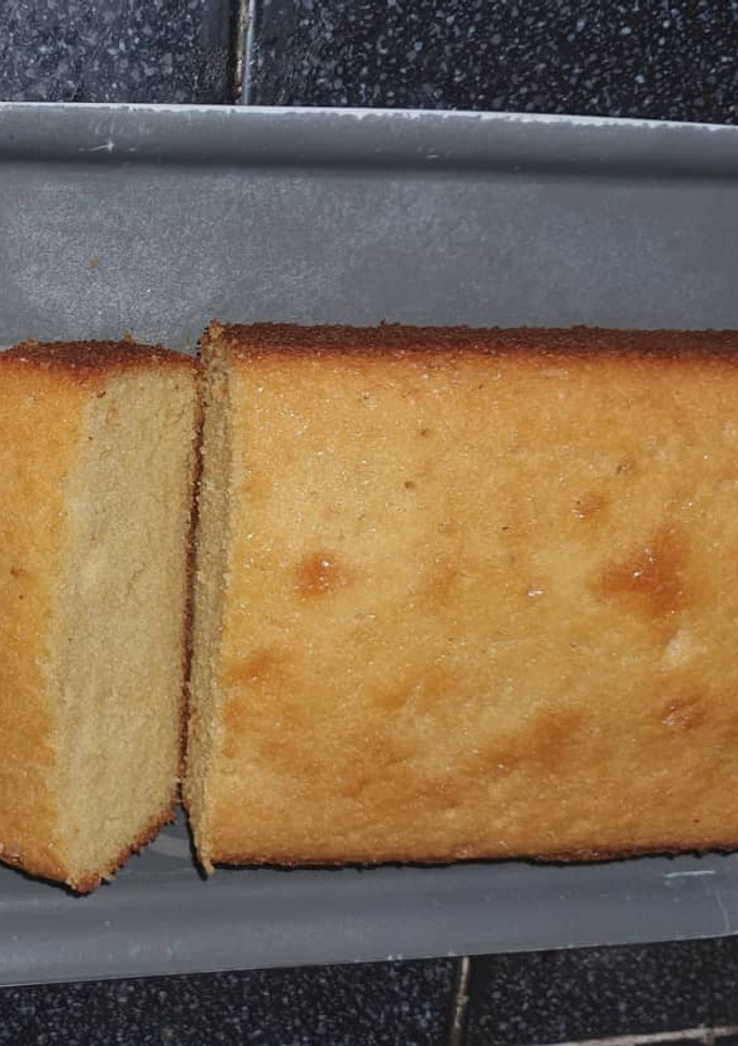 A picture of Lemon Pound Cake with a Simple Lemon Glaze.