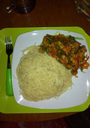 A picture of Shrimp veggie stir-fry with spagettini.