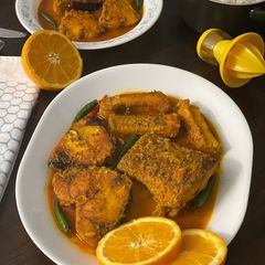 A picture of Rohu Rui Fish In Orange JuiceGravy.