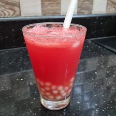 A picture of Lychee boba watermelon drink.
