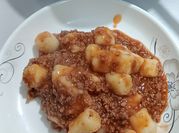 Una foto de gnocchi o ñoquis de papa