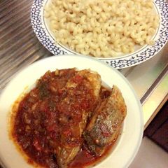 A picture of Pasta (marcaroni) with croaker fish stew.