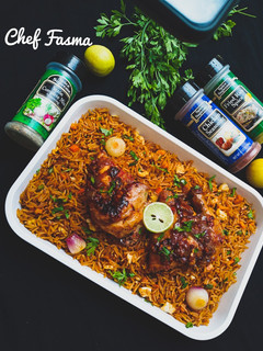 A picture of Chinese fried rice with lemon peppered chicken.