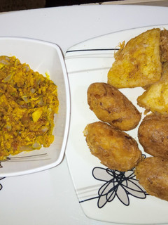 A picture of Yam balls and egg sauce.
