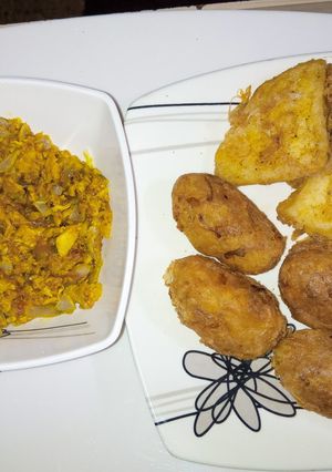 A picture of Yam balls and egg sauce.