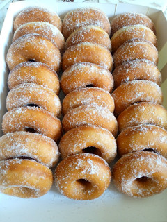 A picture of Sugar coated ring doughnuts.