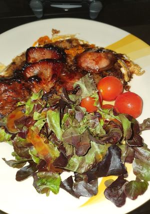 A picture of Baked egg n sweet bacon hash browns.