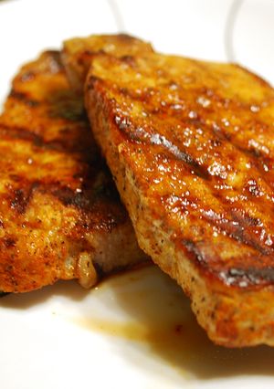 A picture of Seasoned Pork Chops on the Grill.