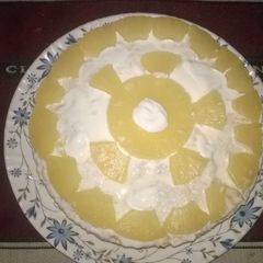 A picture of Pineapple cream cake in microwave.