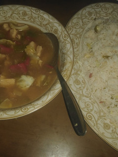 A picture of Chicken chilli with Fried rice.