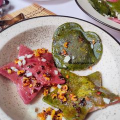 A picture of Spinach Beets Ravioli with Minced Mushroom in Bachmel Sauce.