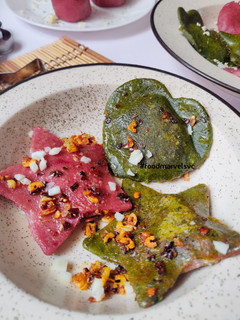 A picture of Spinach Beets Ravioli with Minced Mushroom in Bachmel Sauce.