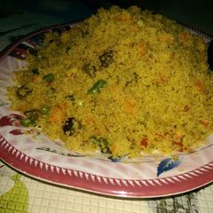 A picture of Cous-cous jollof wit veggies.