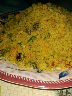 A picture of Cous-cous jollof wit veggies.