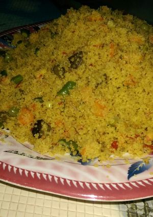 A picture of Cous-cous jollof wit veggies.