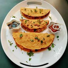 A picture of Broccoli paneer stuffed chilla.