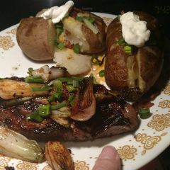 A picture of Spiced Ginger Steak with Spring Onions and Potatoes.