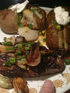 A picture of Spiced Ginger Steak with Spring Onions and Potatoes.