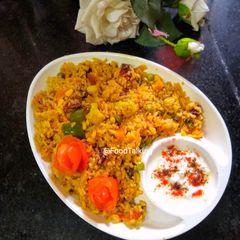 A picture of Paneer Vegetable Biryani with Saffron Milk.