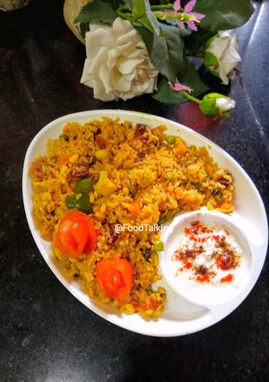 A picture of Paneer Vegetable Biryani with Saffron Milk.