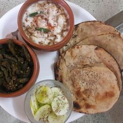 Kurkuri Bhindi with Boondi Raita and Tandoori Roti A picture of Kurkuri Bhindi with Boondi Raita and Tandoori Roti.