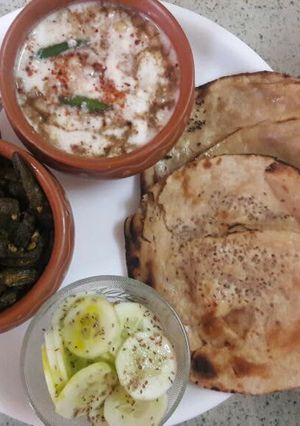 A picture of Kurkuri Bhindi with Boondi Raita and Tandoori Roti.