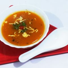 A picture of Tomato,onion soup.